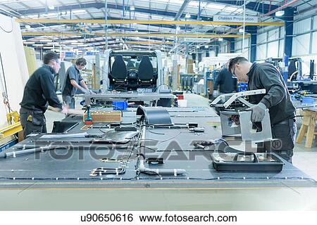 Stock Photograph - Workers on motorhome production line. Fotosearch