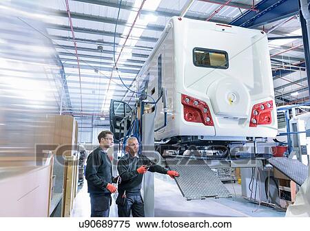 Workers on motorhome production line View Large Photo Image Stock Photography - Workers on motorhome production line. Fotosearch