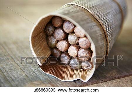 Stock Image - Wrapped package of cuban cigars on table, Cuba. Fotosearch