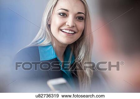 Stock Photo - Young businesswoman and man meeting in office. Fotosearch