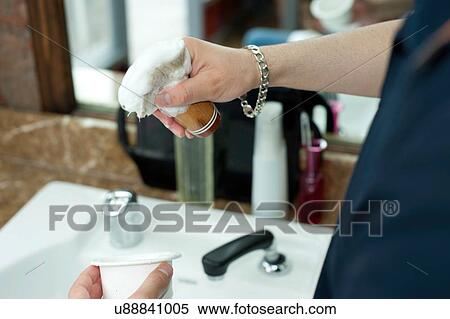 Stock Photography - Young mans hands lathering shaving cream on shaving brush. Fotosearch