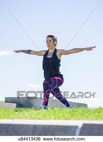 "Young woman holding yoga position, outdoors" View Large Photo Image Stock Photograph - "Young woman holding yoga position, outdoors". Fotosearch