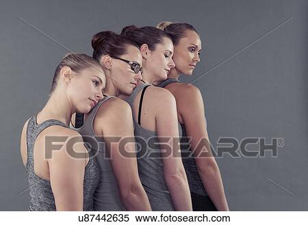 Young women in a row, leaning on each other, grey background View Large Photo Image Stock Photography - Young women in a row, leaning on each other, grey background. Fotosearch