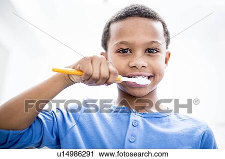 Boy brushing teeth View Large Photo Image Stock Image - Boy brushing teeth. Fotosearch