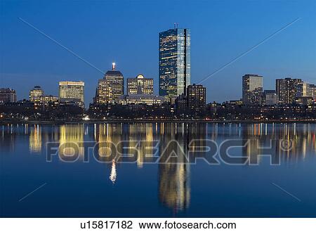 Stock Image - City skyline along Charles River at dusk. Fotosearch