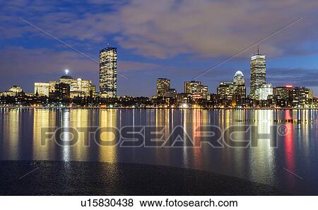 Stock Photo - City skyline along Charles River at dusk. Fotosearch