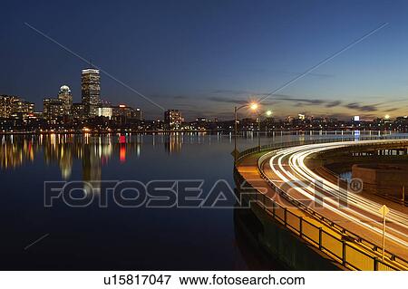 City skyline with traffic at dusk View Large Photo Image Stock Photo - City skyline with traffic at dusk. Fotosearch