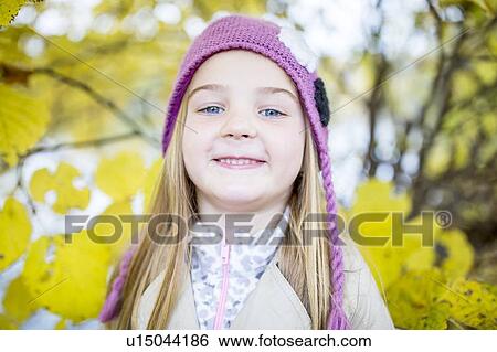 Stock Photograph - Close-up of blonde girl smiling. Fotosearch