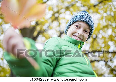 Close-up of boy smiling View Large Photo Image Stock Photo - Close-up of boy smiling. Fotosearch