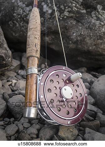 Stock Photo - Close-up of fishing rod and reel. Fotosearch