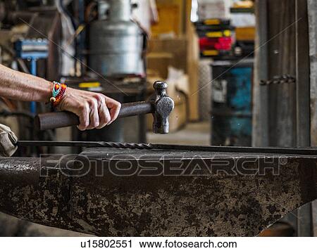 Close up of hand of female blacksmith at work View Large Photo Image Stock Image - Close up of hand of female blacksmith at work. Fotosearch