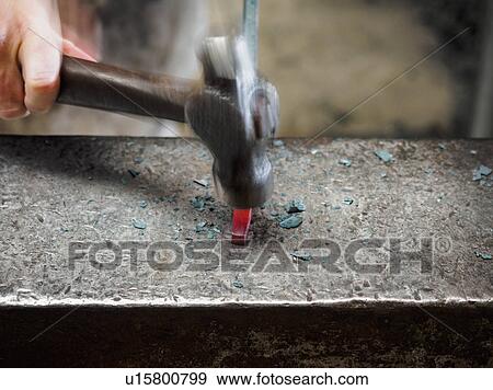 Stock Photo - Close up of hand of female blacksmith with hammer. Fotosearch