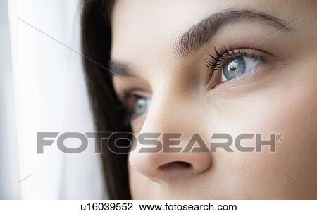 Close up of young woman with blue eyes View Large Photo Image Stock Image - Close up of young woman with blue eyes. Fotosearch