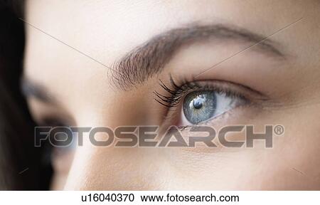 Close up of young woman with blue eyes View Large Photo Image Stock Image - Close up of young woman with blue eyes. Fotosearch