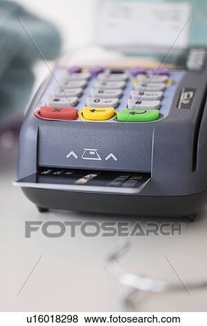 Stock Photo - Credit card reader on counter. Fotosearch