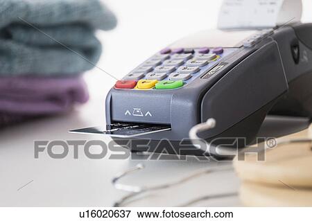 Credit card reader on counter View Large Photo Image Stock Photo - Credit card reader on counter. Fotosearch