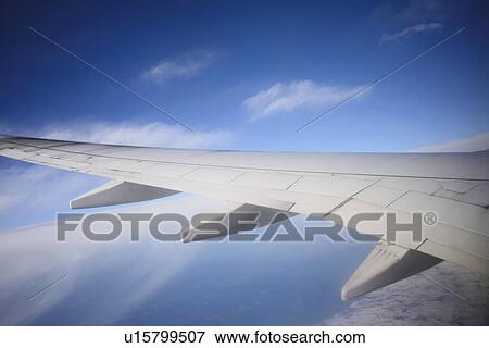 Stock Photo - Cropped image of airplane in sky. Fotosearch