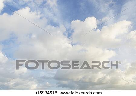 Cumulus clouds in afternoon sky View Large Photo Image Stock Photo - Cumulus clouds in afternoon sky. Fotosearch