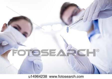 Dentist and dental assistant View Large Photo Image Stock Photo - Dentist and dental assistant. Fotosearch