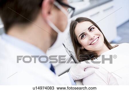 Dentist and patient smiling View Large Photo Image Stock Image - Dentist and patient smiling. Fotosearch