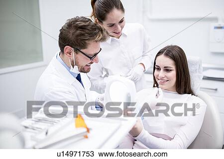 Dentist and patient with tooth veneers View Large Photo Image Stock Image - Dentist and patient with tooth veneers. Fotosearch