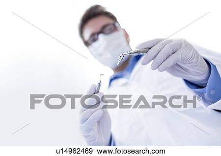 Stock Photo - Dentist with angled mirror. Fotosearch