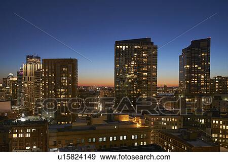 Downtown district at dusk View Large Photo Image Stock Photo - Downtown district at dusk. Fotosearch