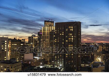 Downtown district at dusk View Large Photo Image Stock Photo - Downtown district at dusk. Fotosearch