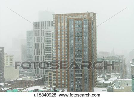 Downtown district in snow storm View Large Photo Image Stock Photo - Downtown district in snow storm. Fotosearch