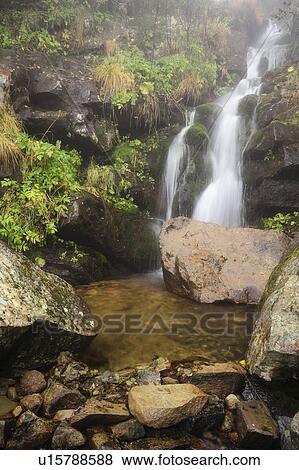 Stock Photo - Dzembronskie waterfalls among rocks. Fotosearch