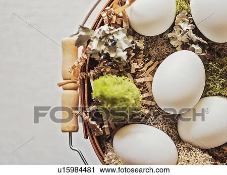 Stock Image - Eggs in basket. Fotosearch