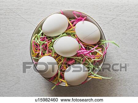 Eggs in bowl and colorful streamers View Large Photo Image Stock Image - Eggs in bowl and colorful streamers. Fotosearch