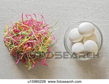 Eggs in bowl and colorful streamers View Large Photo Image Stock Photo - Eggs in bowl and colorful streamers. Fotosearch