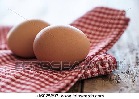 Eggs lying on tablecloth View Large Photo Image Stock Photo - Eggs lying on tablecloth. Fotosearch