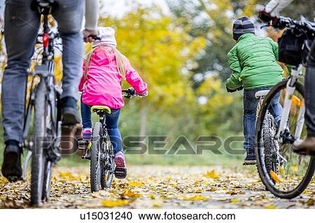 Family cycling together View Large Photo Image Stock Image - Family cycling together. Fotosearch