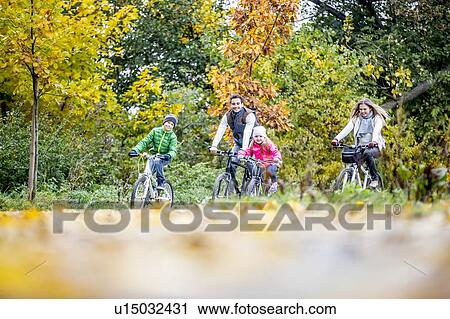 Family cycling together View Large Photo Image Stock Image - Family cycling together. Fotosearch