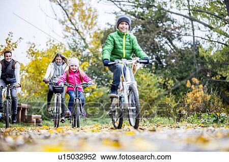 Family cycling together View Large Photo Image Stock Image - Family cycling together. Fotosearch