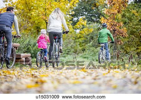 Family cycling together View Large Photo Image Stock Photo - Family cycling together. Fotosearch