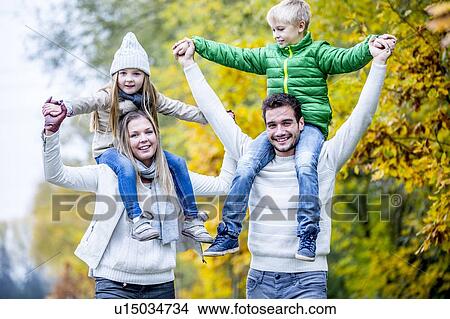 Picture - Family enjoying in autumn. Fotosearch