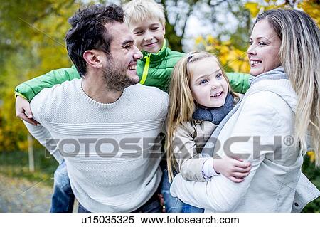 Family enjoying in autumn View Large Photo Image Stock Photography - Family enjoying in autumn. Fotosearch