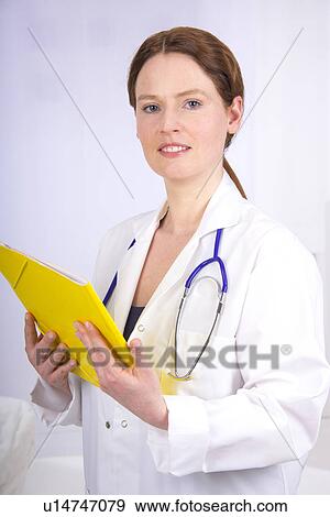 Female doctor with medical file View Large Photo Image Stock Photo - Female doctor with medical file. Fotosearch