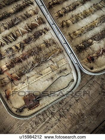 Stock Image - Fishing tackles in box. Fotosearch