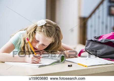 Girl (8-9) doing homework View Large Photo Image Stock Image - Girl (8-9) doing homework. Fotosearch