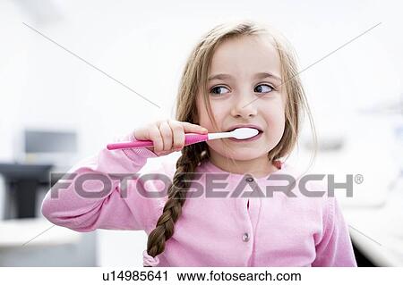Girl brushing teeth View Large Photo Image Stock Image - Girl brushing teeth. Fotosearch