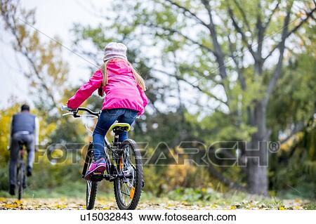 Girl cycling View Large Photo Image Stock Image - Girl cycling. Fotosearch