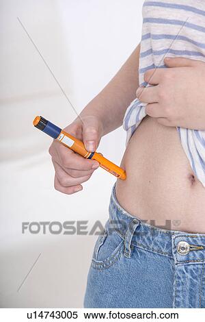 Girl with diabetes injecting herself View Large Photo Image Stock Photography - Girl with diabetes injecting herself. Fotosearch