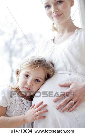 Girl with pregnant mother View Large Photo Image Picture - Girl with pregnant mother. Fotosearch