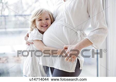 Girl with pregnant mother View Large Photo Image Picture - Girl with pregnant mother. Fotosearch