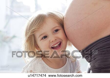 Girl with pregnant mother View Large Photo Image Picture - Girl with pregnant mother. Fotosearch