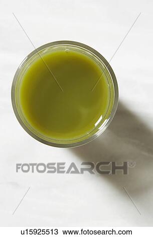 Glass of green juice View Large Photo Image Stock Image - Glass of green juice. Fotosearch